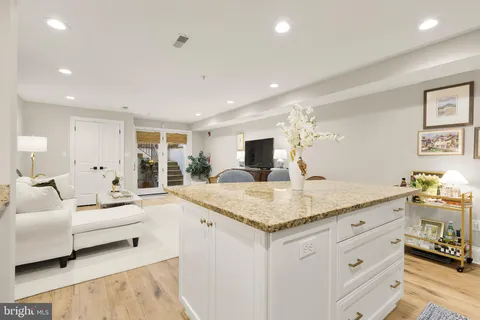 a view of living room with granite countertop furniture and fireplace