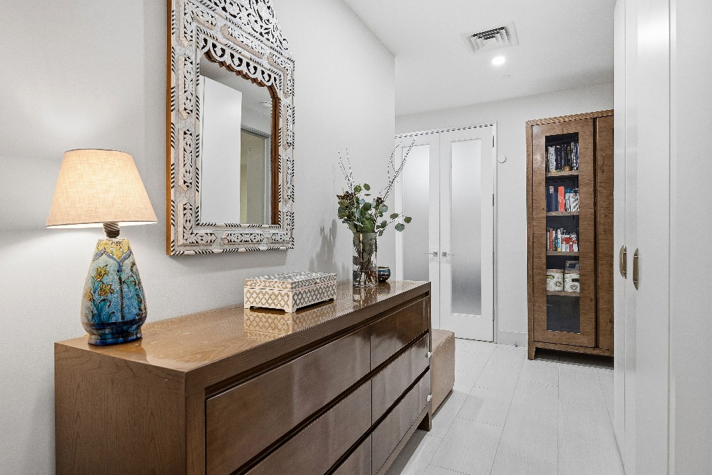 111 Fulton Street, Unit 824 Manhattan, NY 10038 - Photo 11 of 35 a bathroom with a sink and a mirror