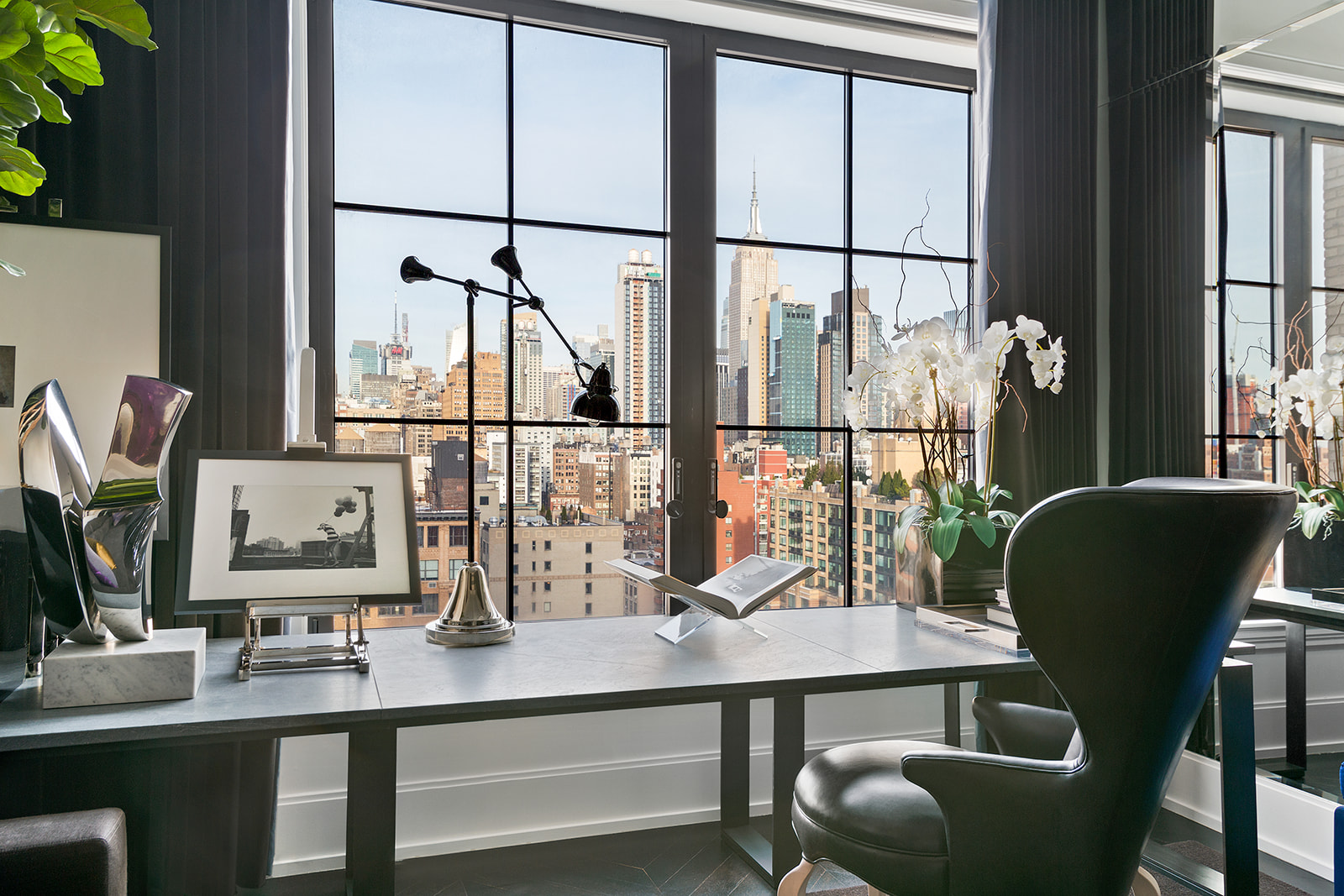 212 West 18th Street, Unit 12E Manhattan, NY 10011 - Photo 2 of 13 a dining room with furniture and window