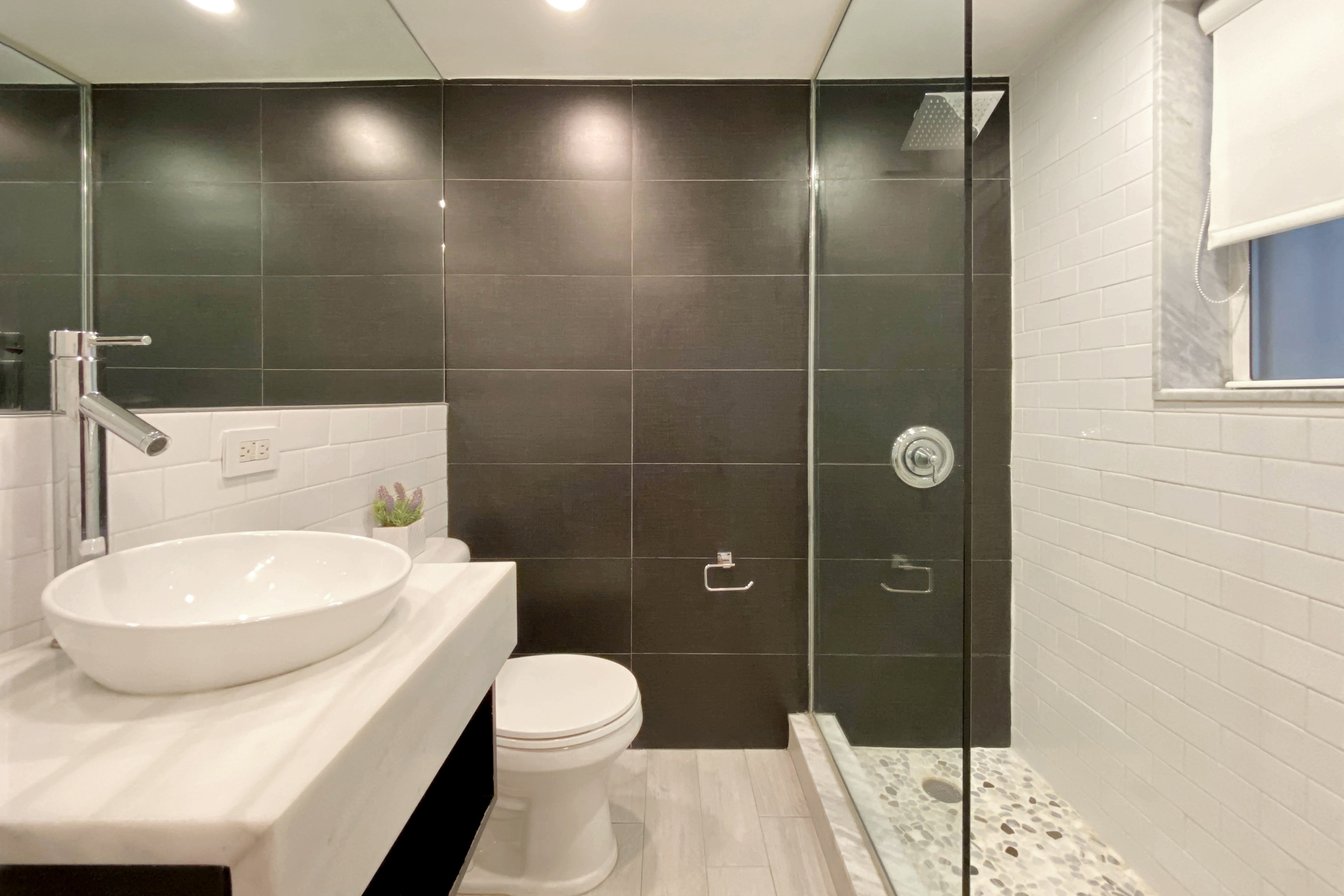 155 East 49th Street, Unit 1E Manhattan, NY 10017 - Photo 6 of 8 a bathroom with a toilet and a shower