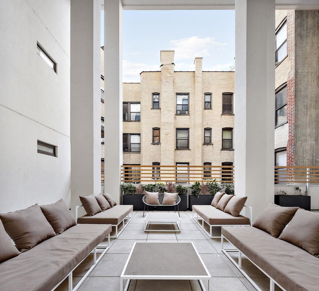 856 Washington Avenue, Unit 9A Brooklyn, NY 11238 - Photo 17 of 25 a balcony with furniture and rug