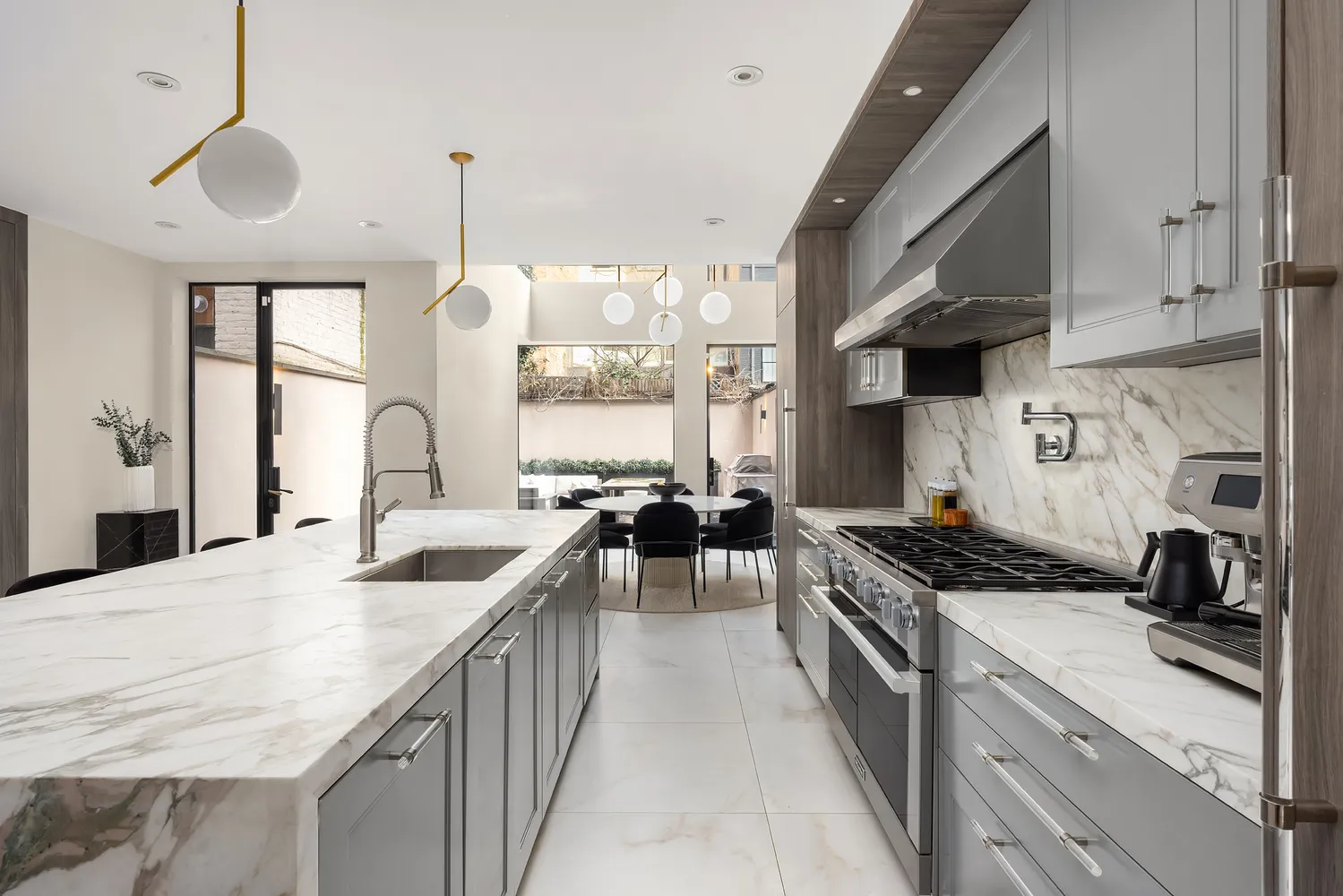 a kitchen with a table and chairs