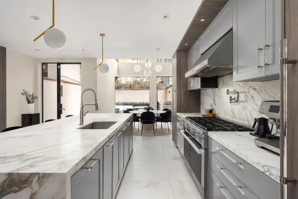 a kitchen with a table and chairs