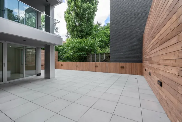 a view of a pathway besides a house