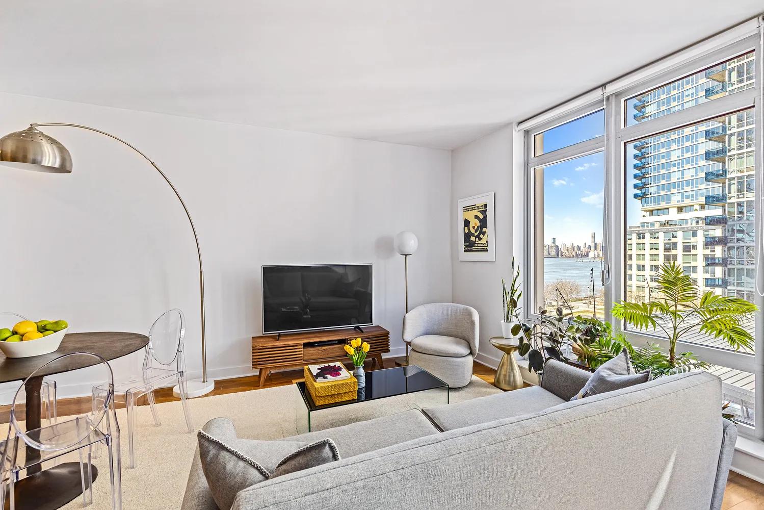 a living room with furniture and a flat screen tv