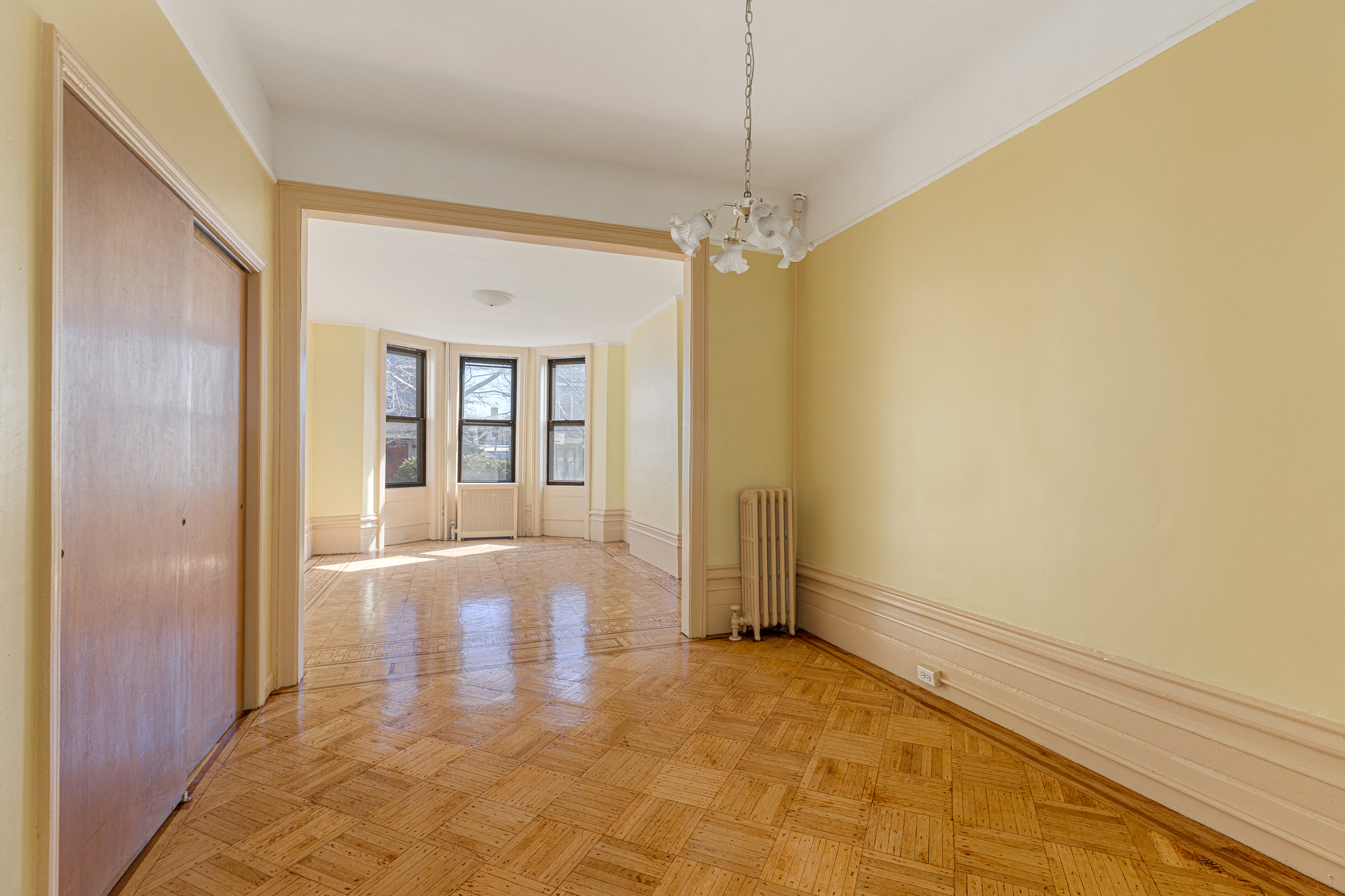 304 East 8th Street Brooklyn, NY 11218 - Photo 20 of 32 a view of livingroom with hardwood floor and window