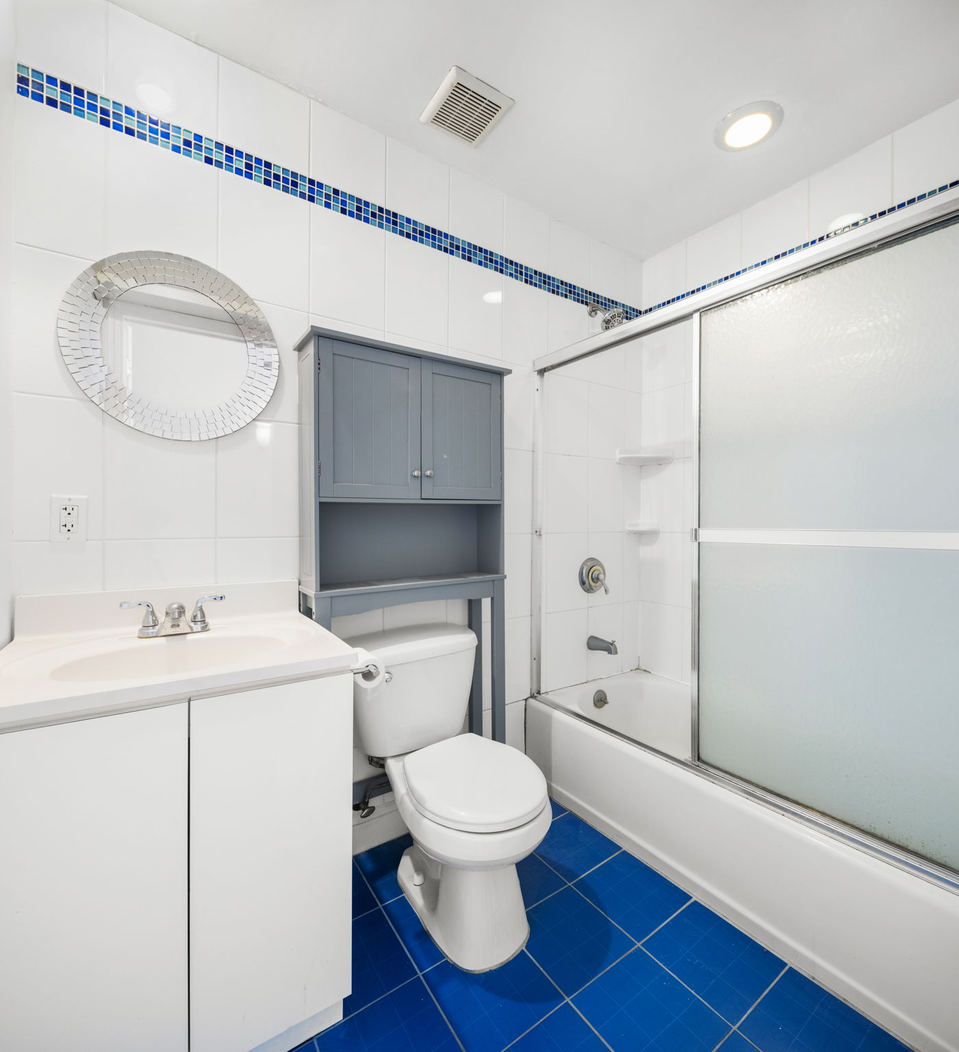 231 Grand Street, Unit 5R Hoboken, NJ 07030 - Photo 7 of 9 a bathroom with a toilet a sink and a mirror