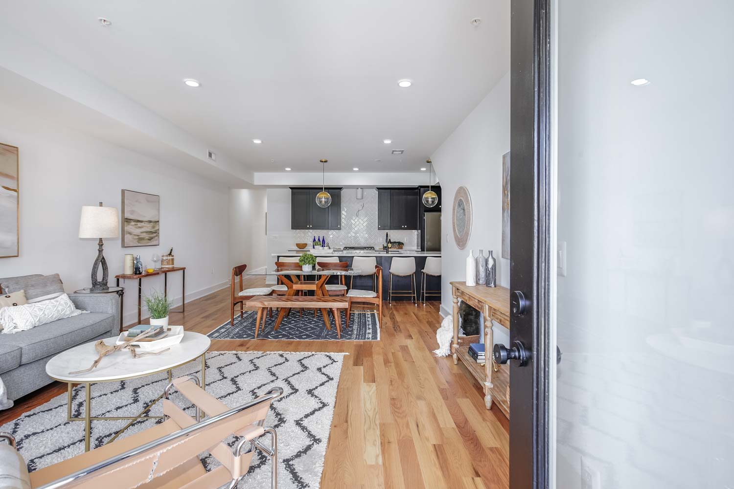 428 Manor Place Northwest, Unit 1 Washington, DC 20010 - Photo 3 of 27 a view of a dining room with furniture a rug and wooden floor