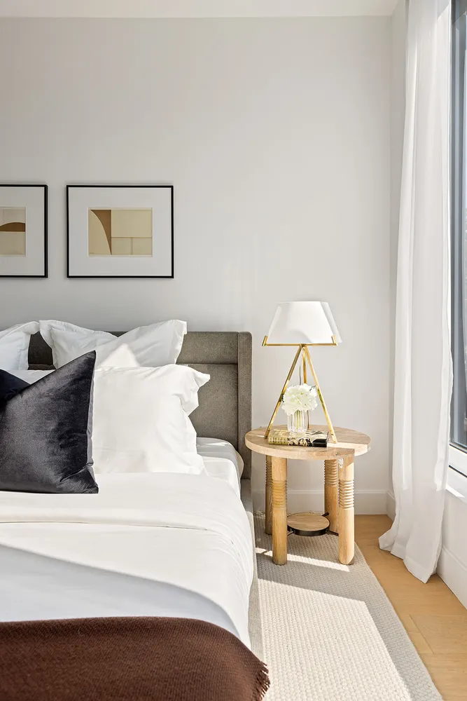 a spacious bedroom with a bed and a window