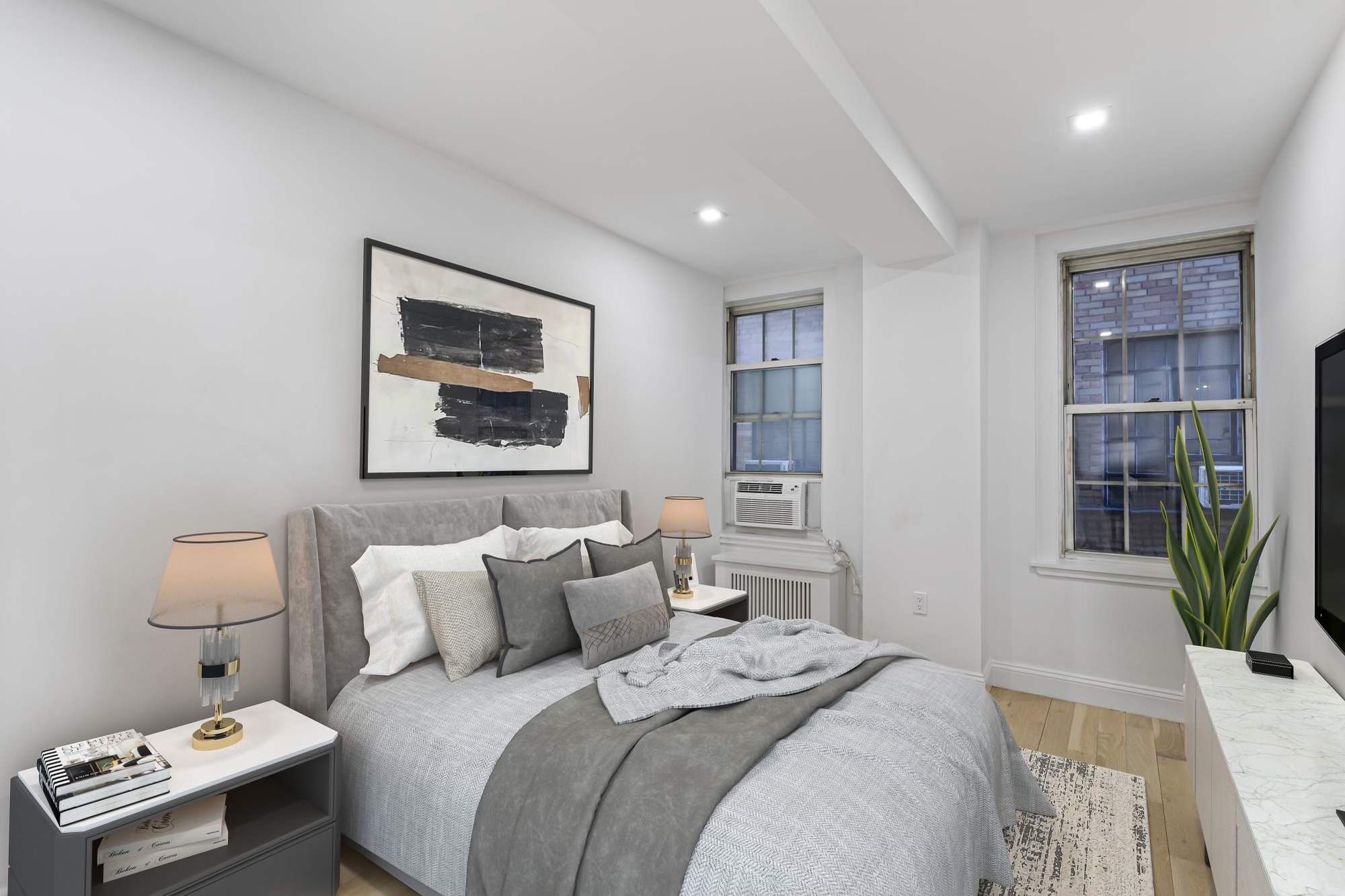 16 Park Avenue, Unit 6CD Manhattan, NY 10016 - Photo 2 of 12 a bedroom with a bed and a potted plant