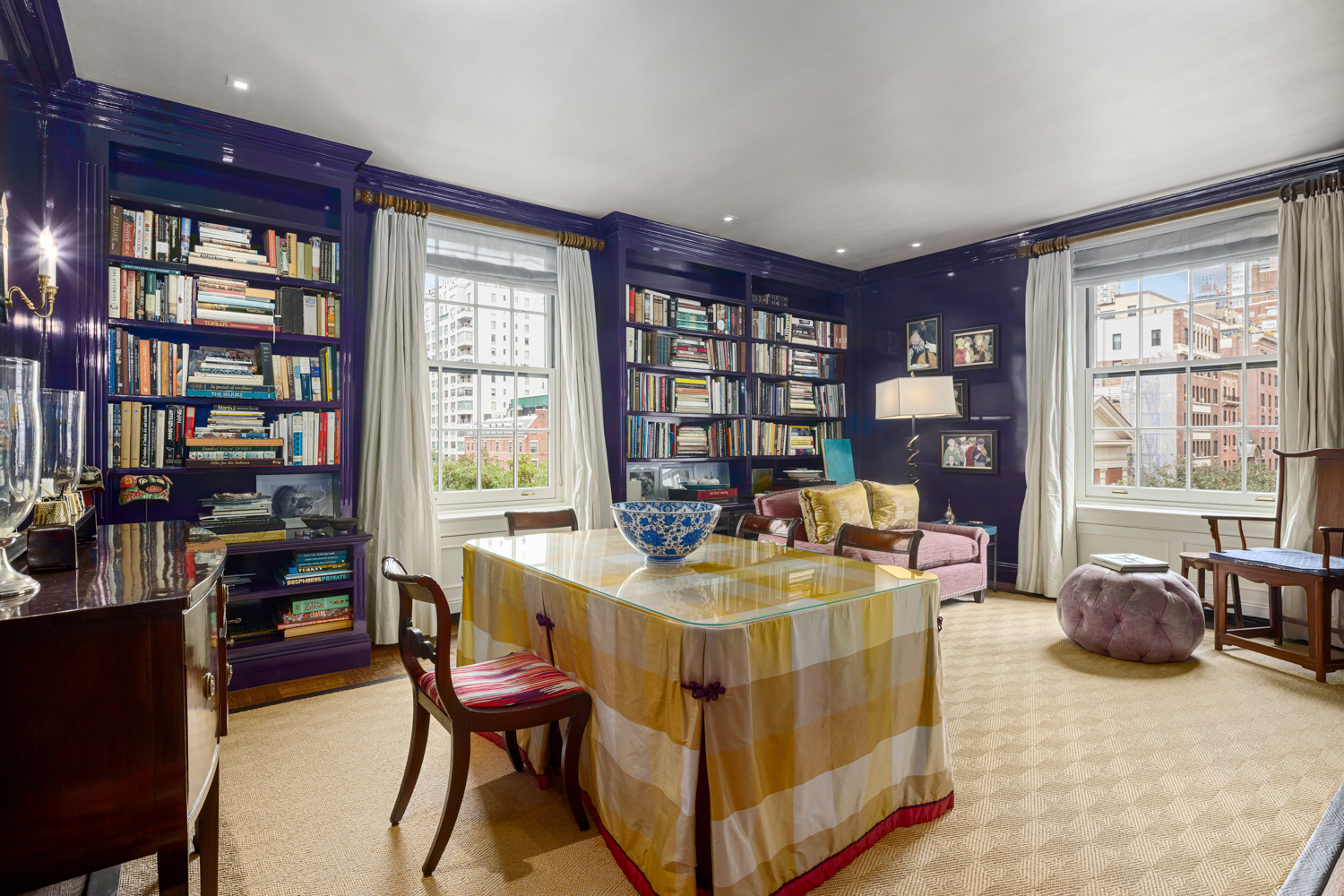 570 Park Avenue, Unit 4A Manhattan, NY 10065 - Photo 4 of 20 a living room with furniture and a book shelf