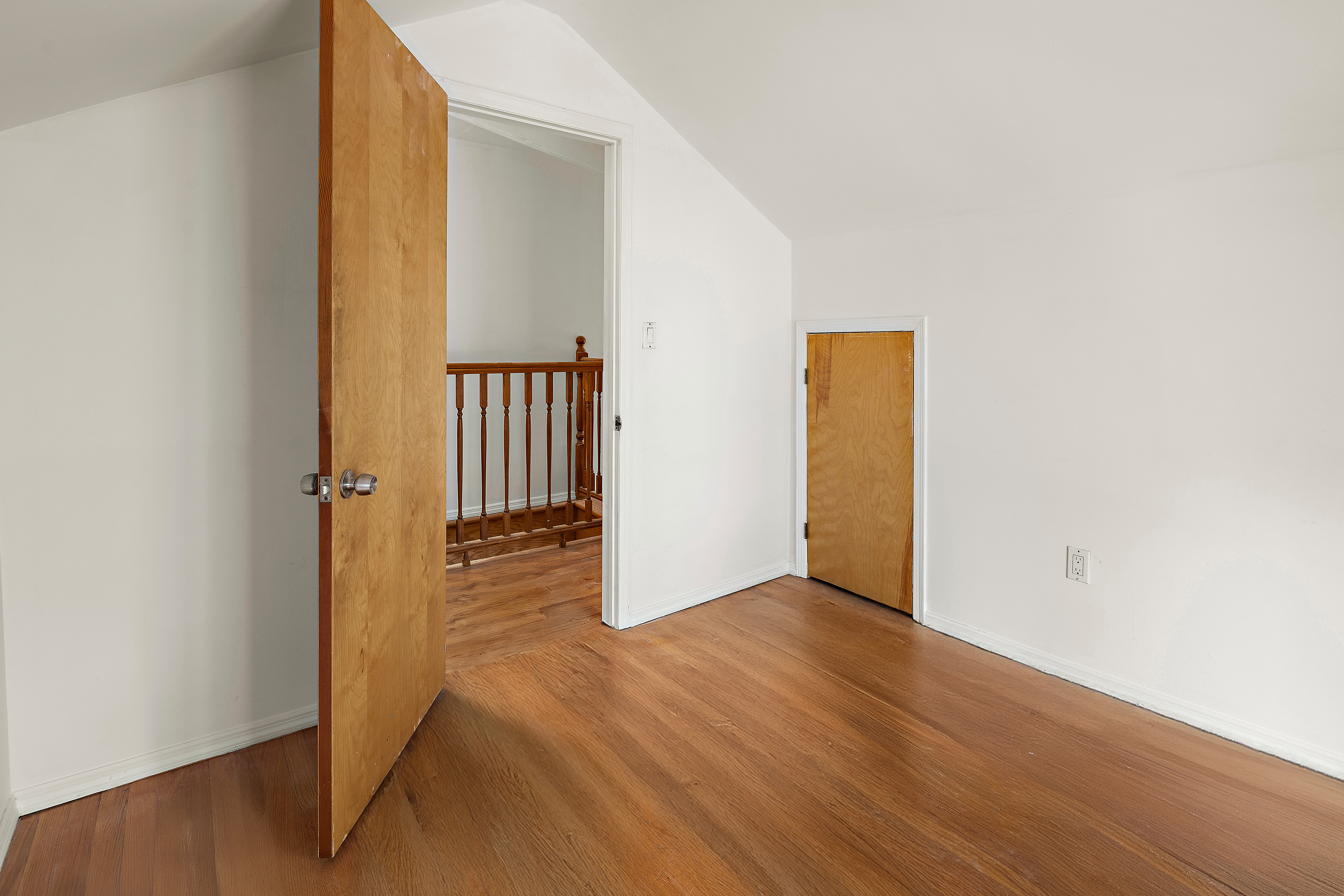 558 84th Street Brooklyn, NY 11209 - Photo 22 of 25 an empty room with wooden floor and hallway