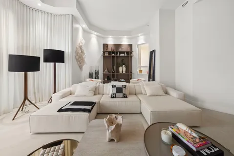 a view of a livingroom with furniture and window