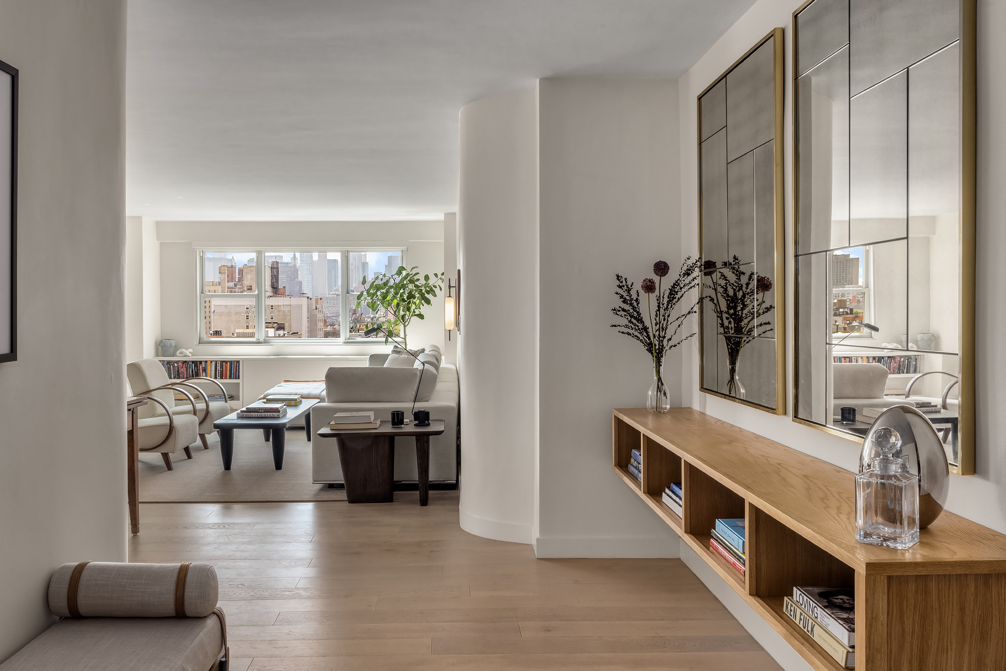 101 West 12th Street, Unit 12R Manhattan, NY 10011 - Photo 5 of 21 a living room with furniture and a large window