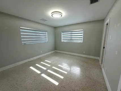 a view of empty room with windows