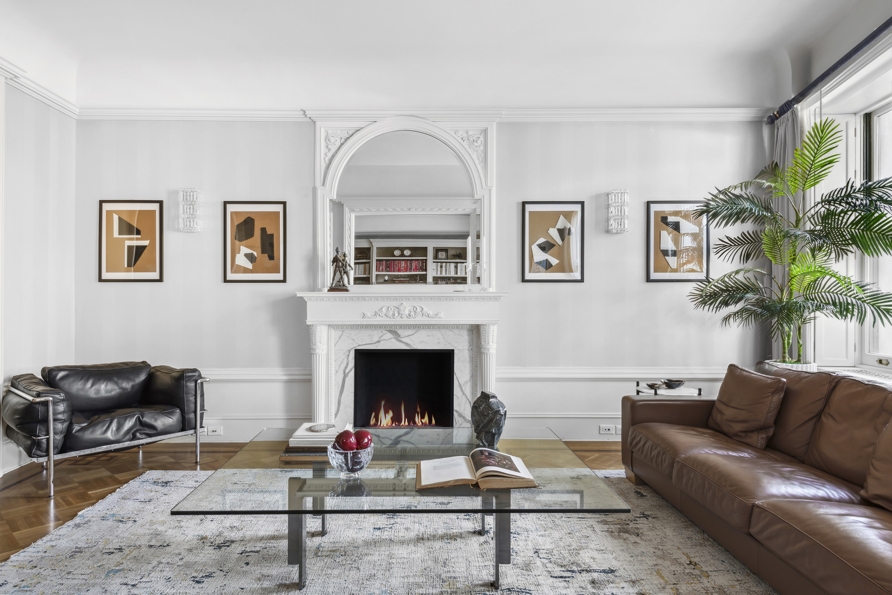 67 Riverside Drive, Unit 1A Manhattan, NY 10024 - Photo 2 of 18 a living room with furniture and a fireplace