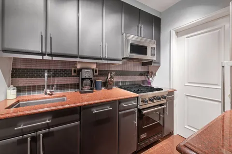 a kitchen with a stove and a microwave