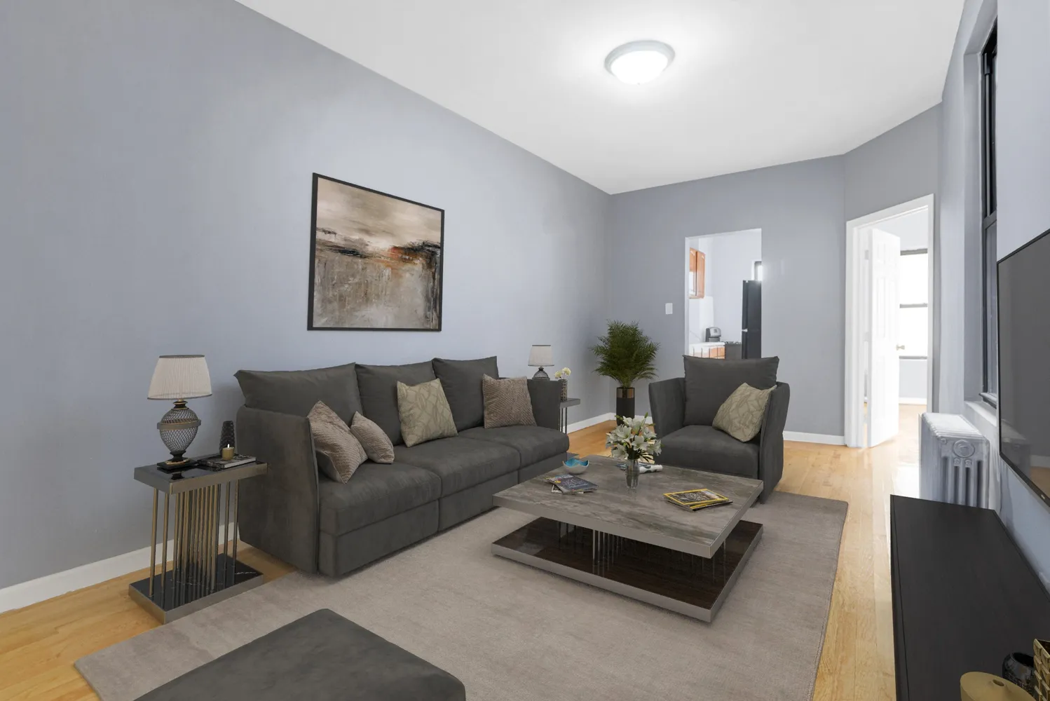 a view of empty room with wooden floor