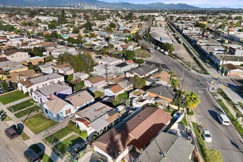 an aerial view of residential houses with outdoor space