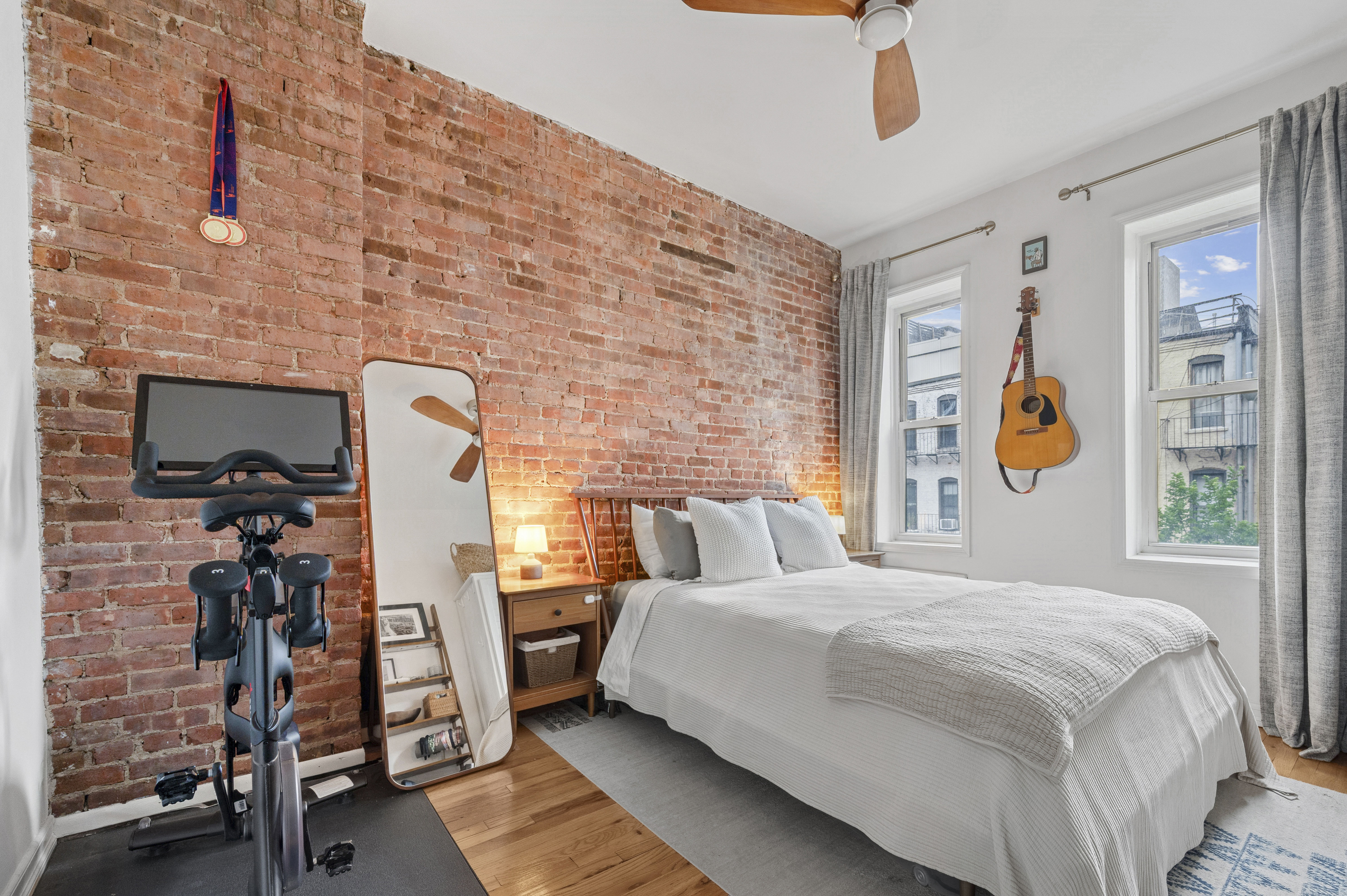 331 East 92nd Street, Unit 4B Manhattan, NY 10128 - Photo 4 of 7 a bedroom with a bed and a window