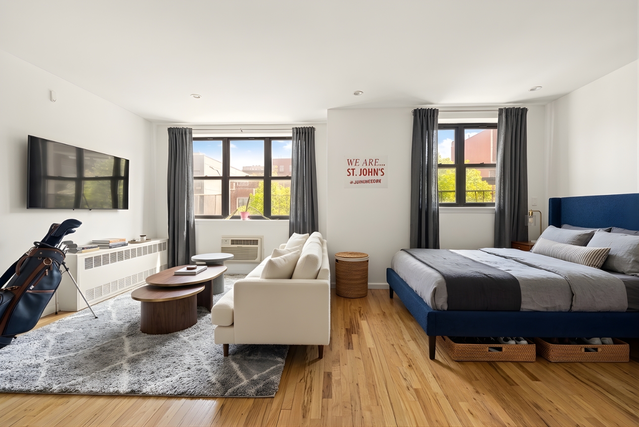 109 Pulaski Street Brooklyn, NY 11206 - Photo 6 of 14 a bedroom with a bed and a couch