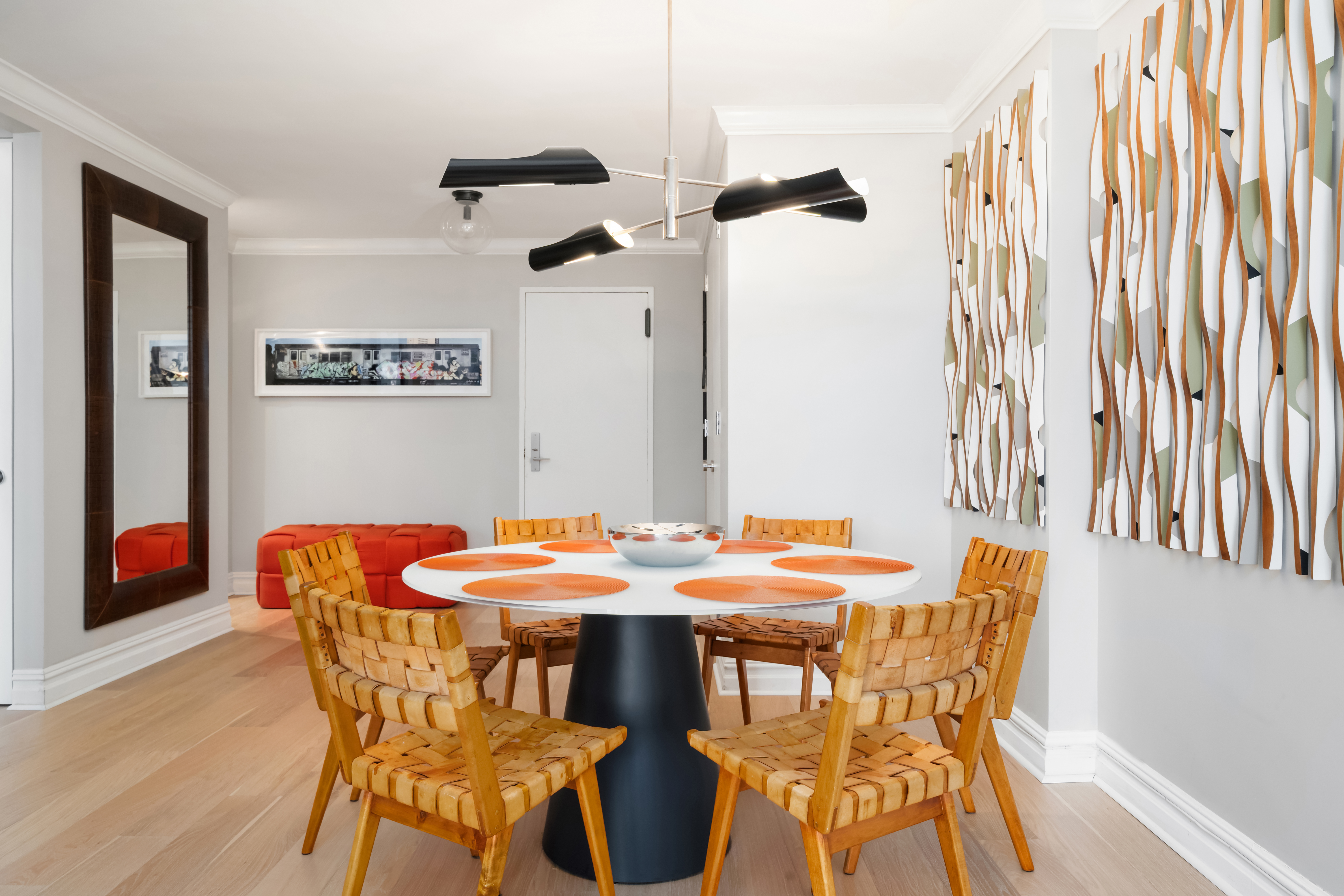 77 West 55th Street, Unit 9F Manhattan, NY 10019 - Photo 7 of 11 a dining room with furniture and wooden floor