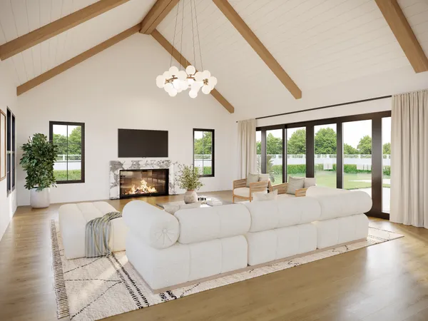 a large bedroom with a large bed and a flat screen tv