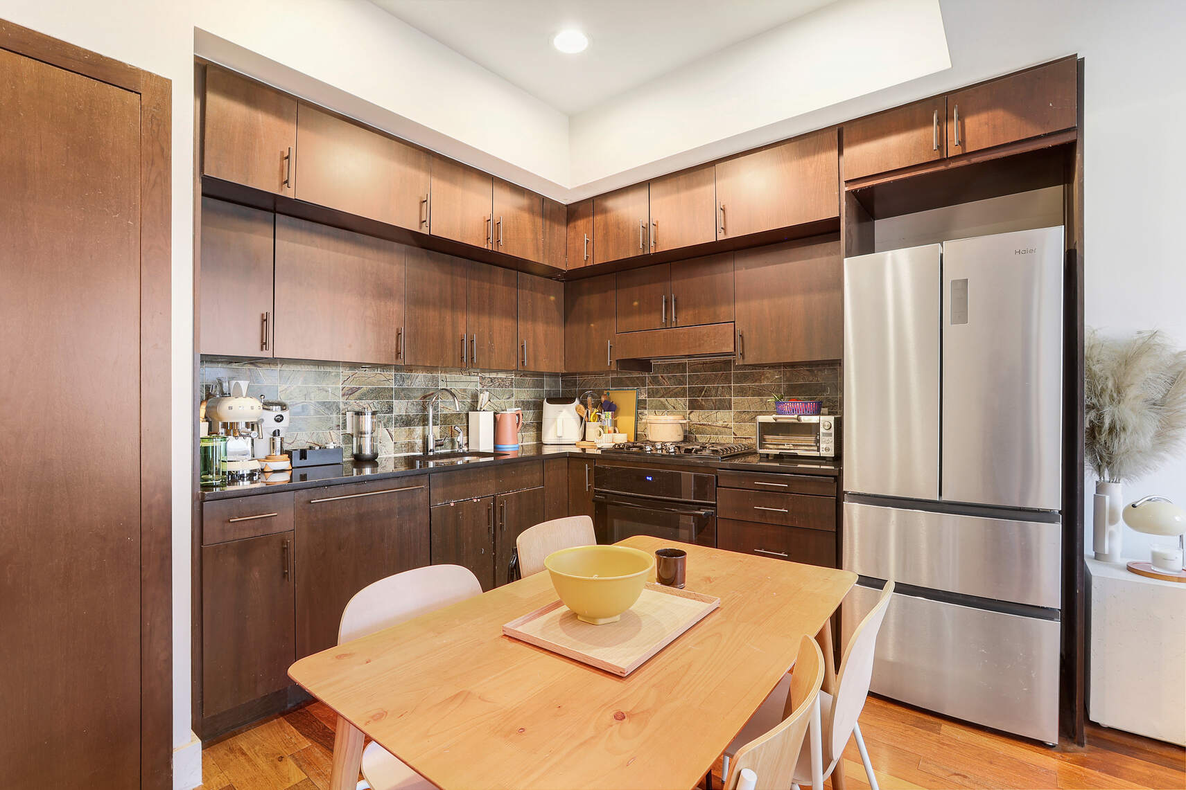 150 Myrtle Avenue, Unit 1105 Brooklyn, NY 11201 - Photo 3 of 24 a kitchen with stainless steel appliances granite countertop a refrigerator a sink and a stove