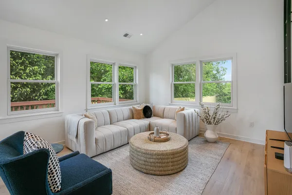 a living room with furniture and a large window