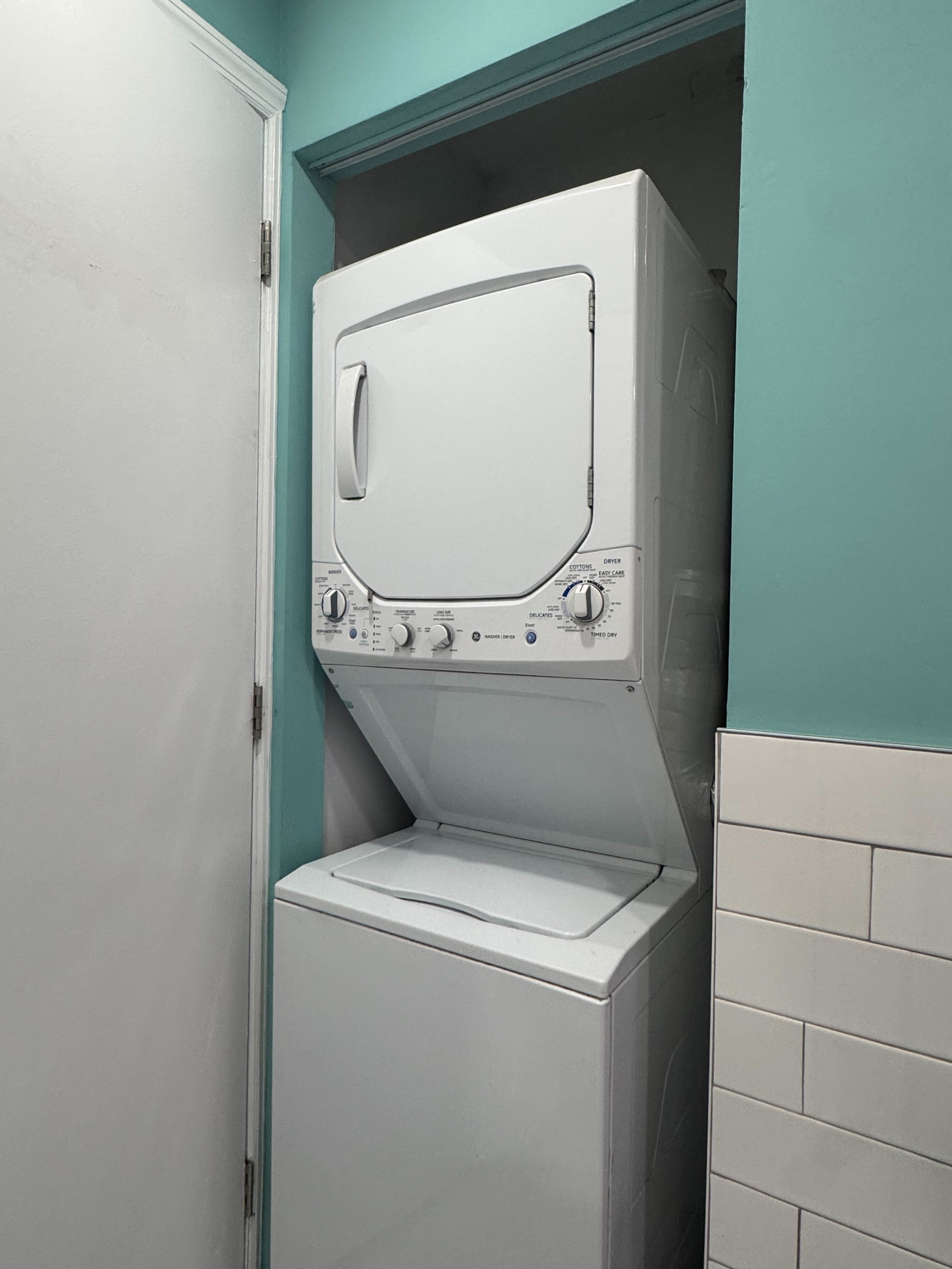212 Front Street, Unit 4 Manhattan, NY 10038 - Photo 7 of 7 a utility room with dryer and washer