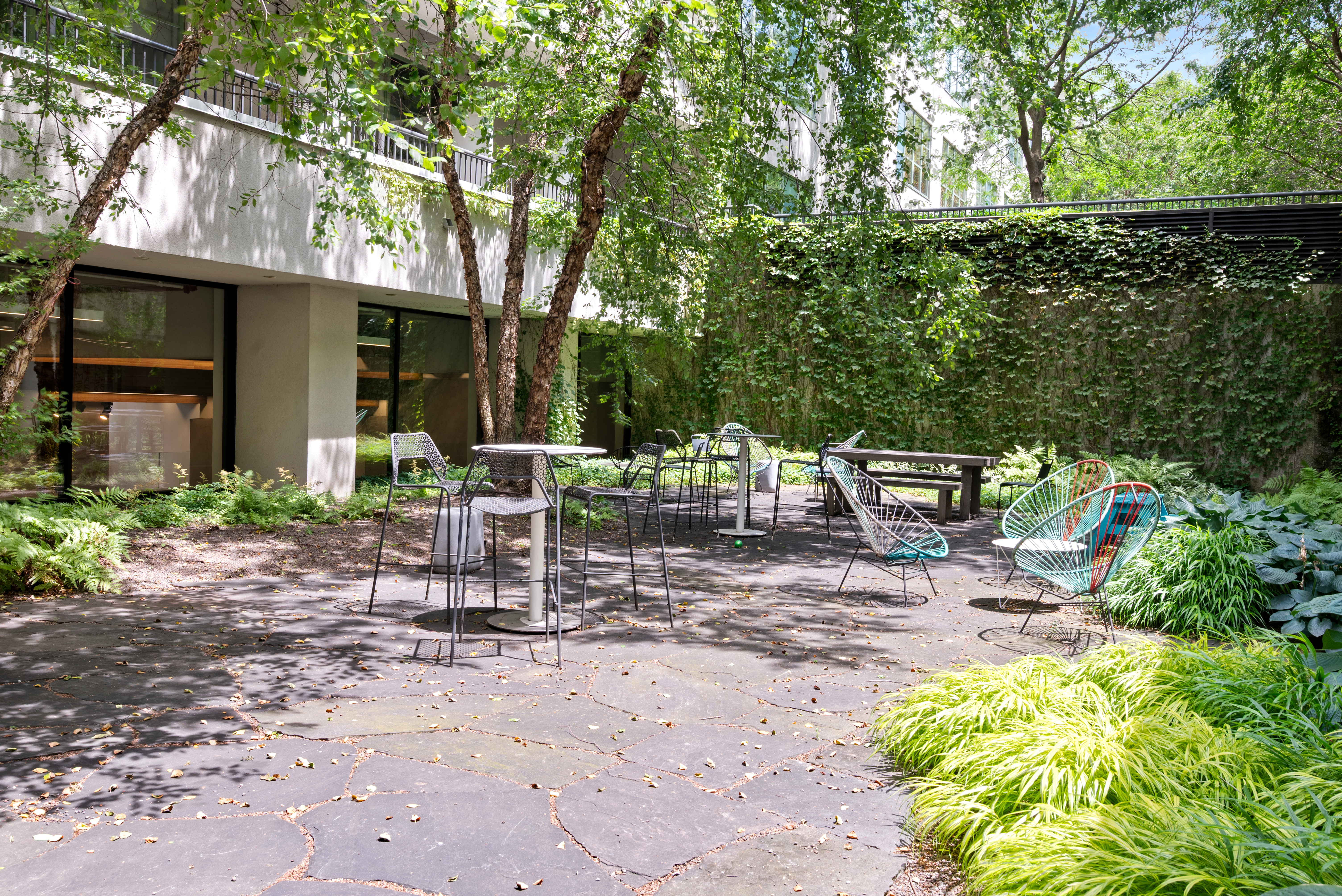 184 Kent Avenue, Unit C107 Brooklyn, NY 11249 - Photo 9 of 18 a view of a chairs and table in backyard