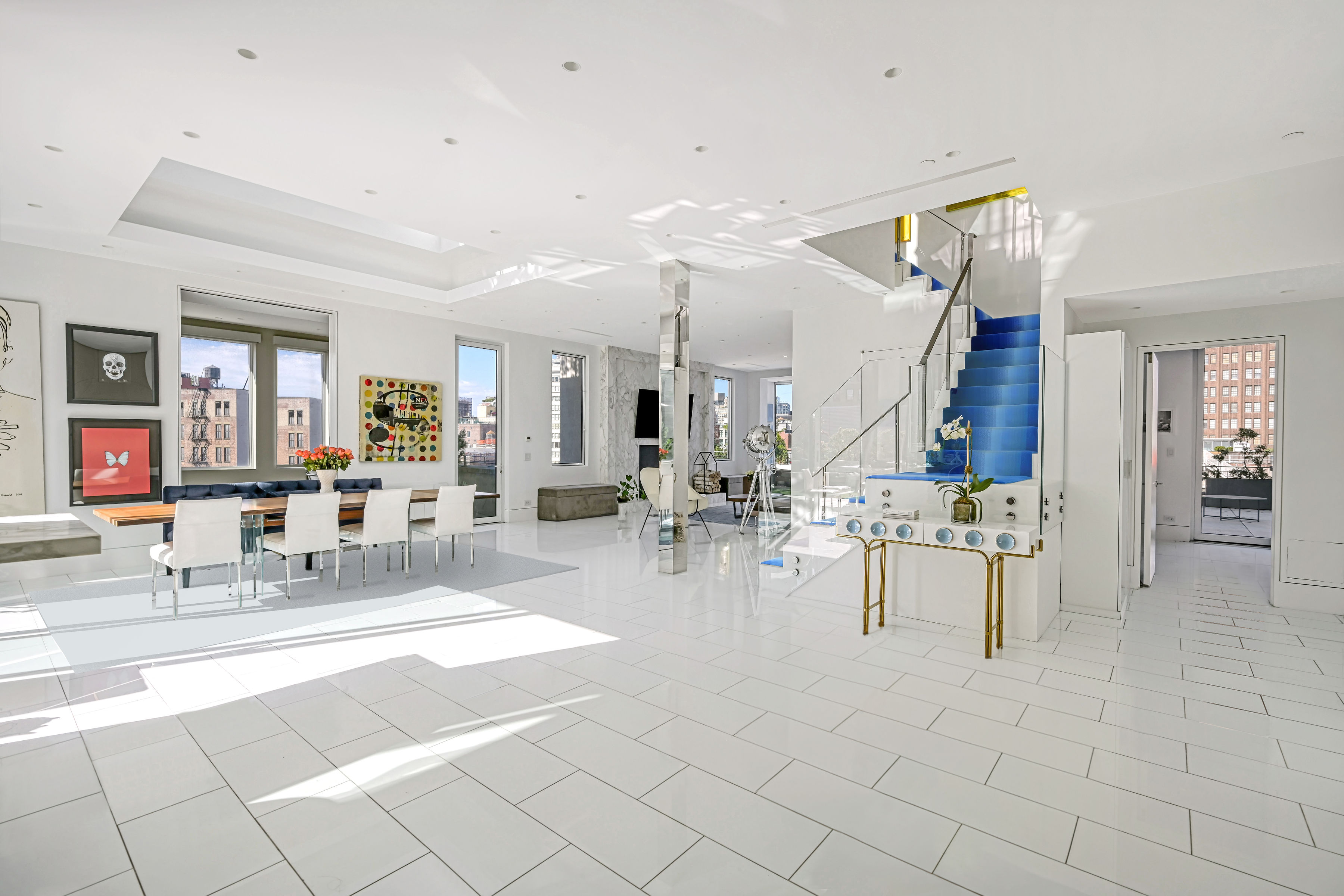 53 Leonard Street, Unit PH Manhattan, NY 10013 - Photo 4 of 24 a living room with furniture and wooden floor