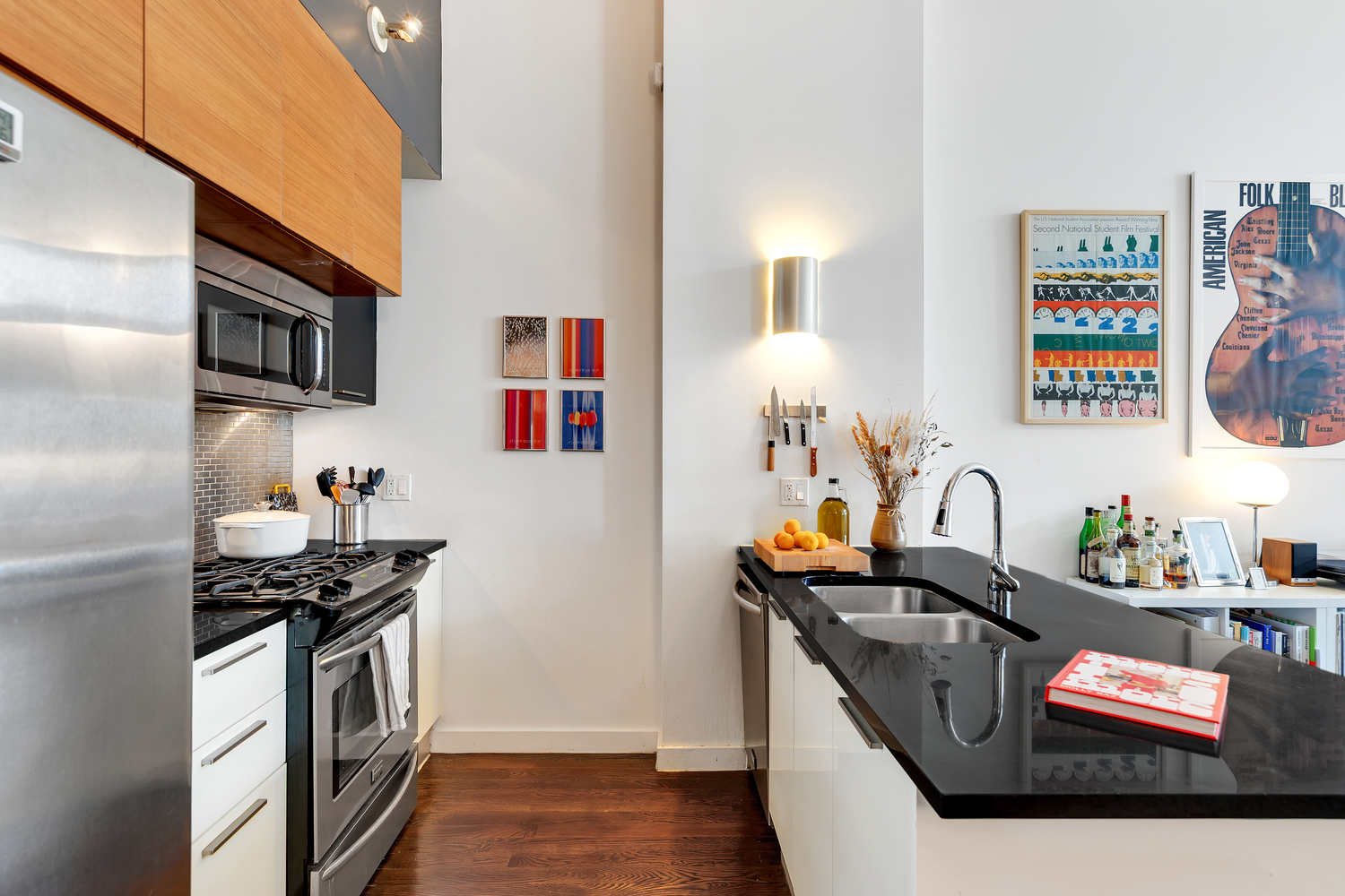 27 Quincy Street, Unit 4D Brooklyn, NY 11238 - Photo 4 of 8 a kitchen with stainless steel appliances a stove a sink and a refrigerator