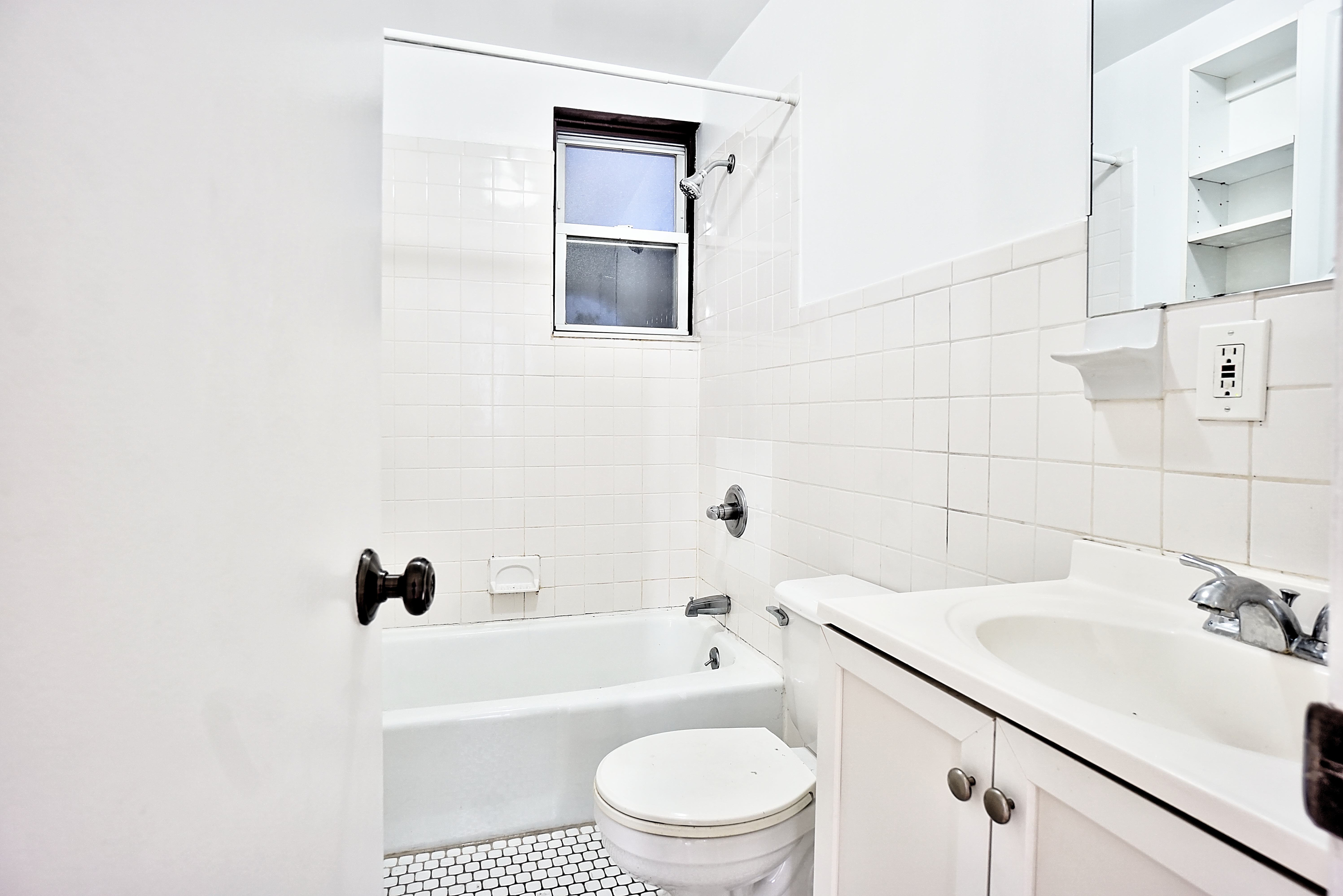 270 East 78th Street, Unit 10 Manhattan, NY 10075 - Photo 6 of 6 a bathroom with a sink a toilet and a bathtub