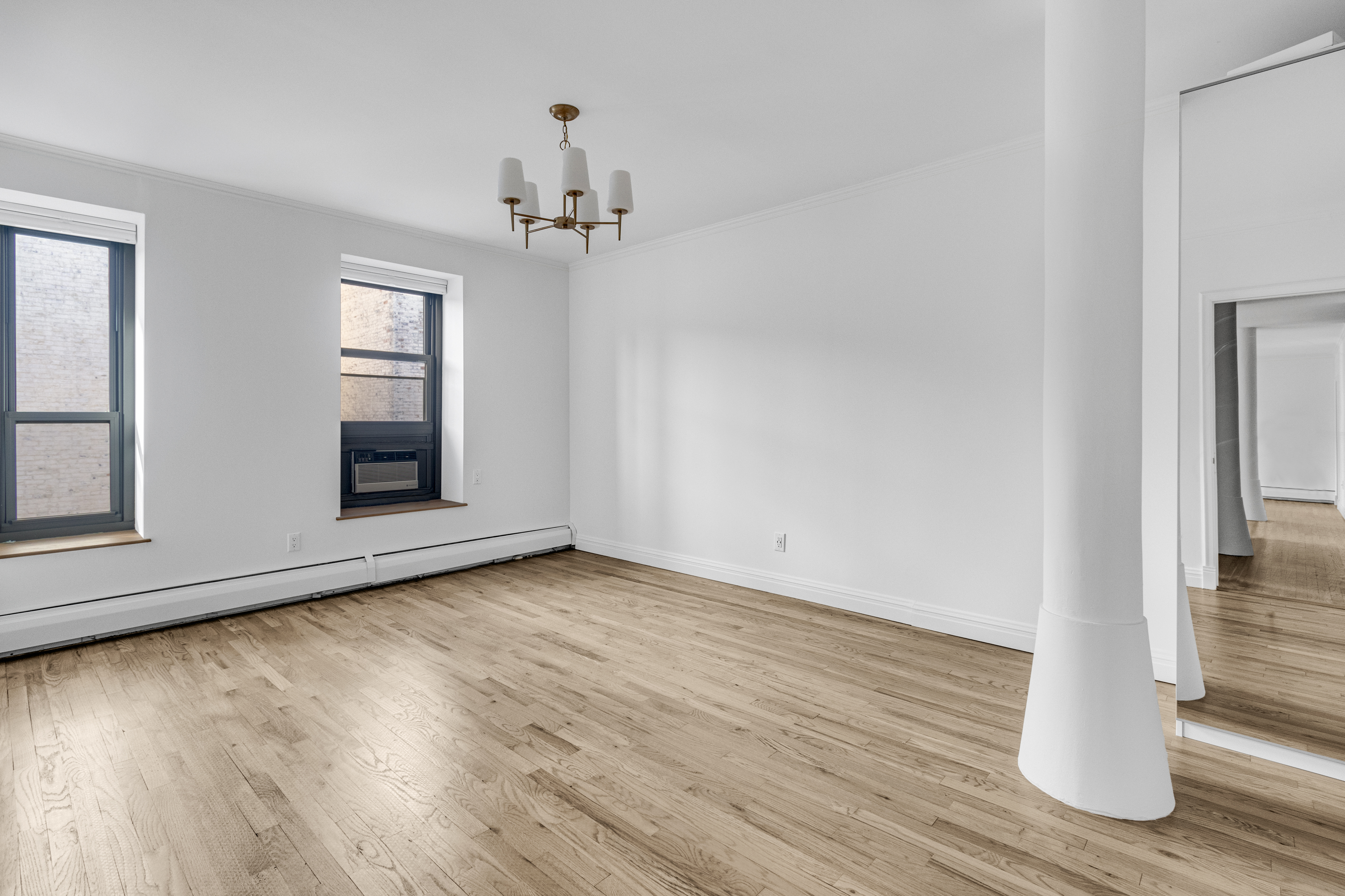 305 West 98th Street, Unit 7CS Manhattan, NY 10025 - Photo 7 of 18 a view of a room with wooden floor and staircase