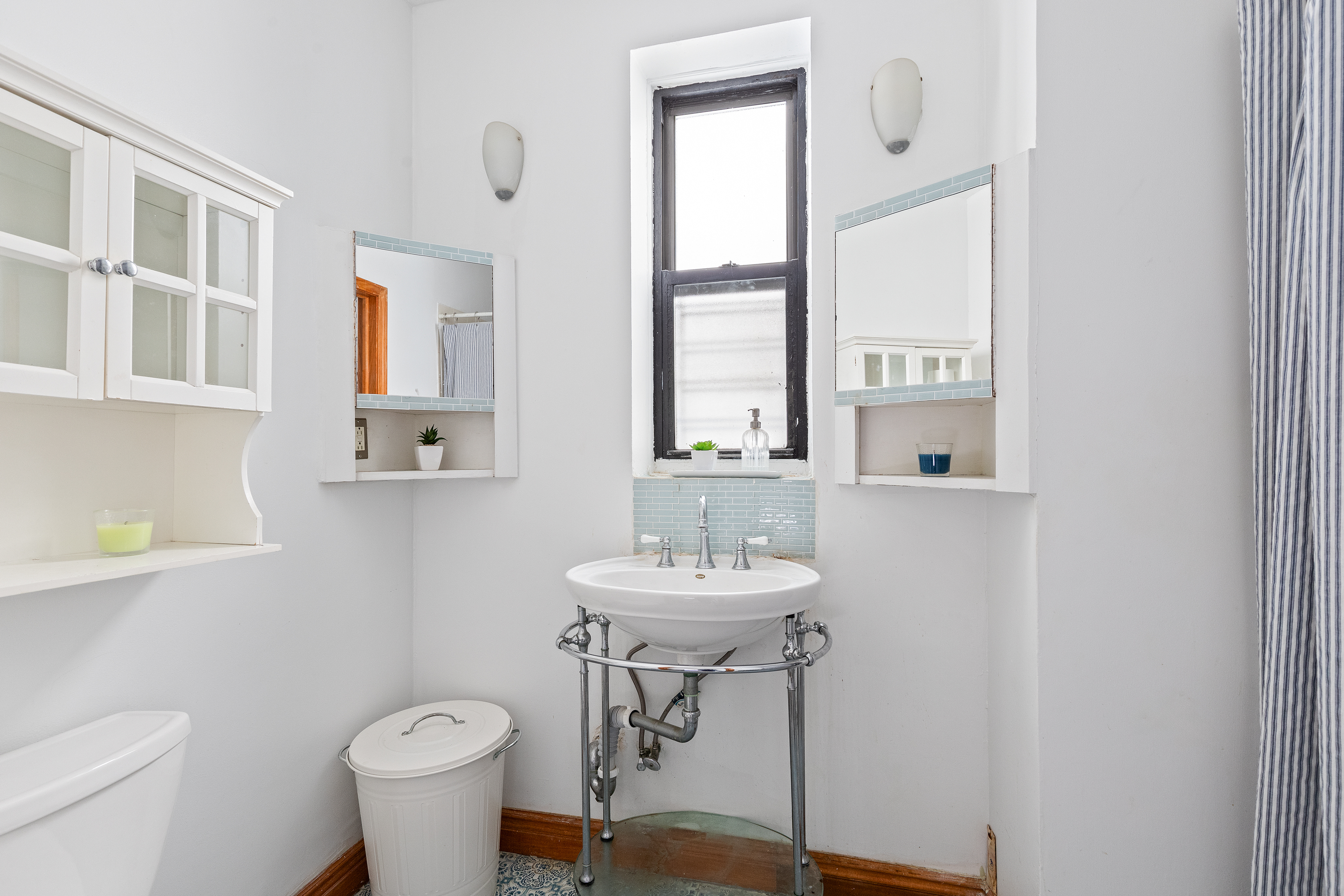 347 5th Avenue, Unit 2L Brooklyn, NY 11215 - Photo 5 of 5 a bathroom with a sink toilet and a mirror