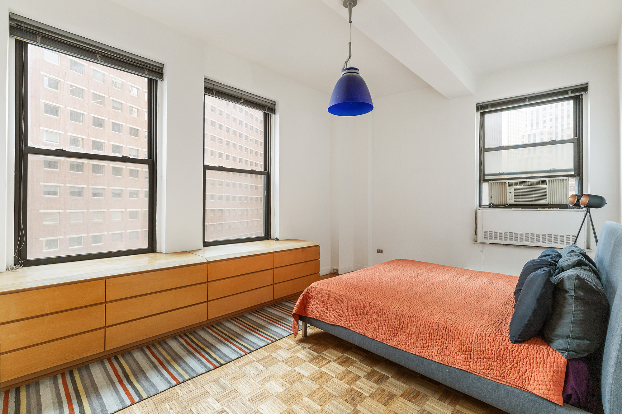 3 Hanover Square, Unit 14EF Manhattan, NY 10004 - Photo 6 of 14 a bedroom with a bed and a window