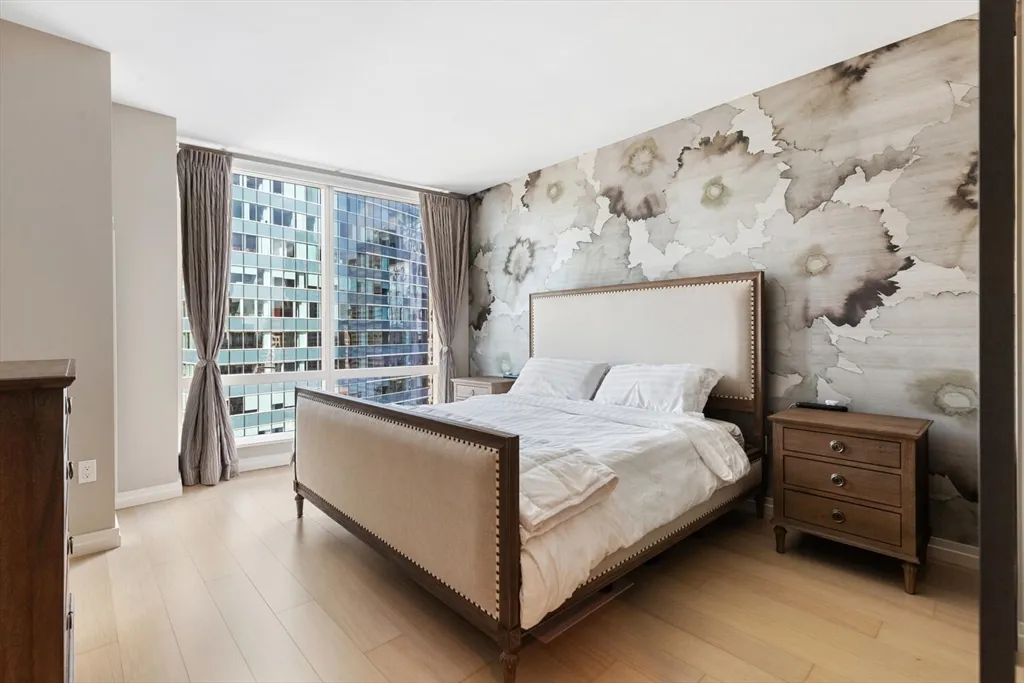 a view of balcony with wooden floor and fence