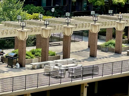 a view of swimming pool with outdoor seating and plants