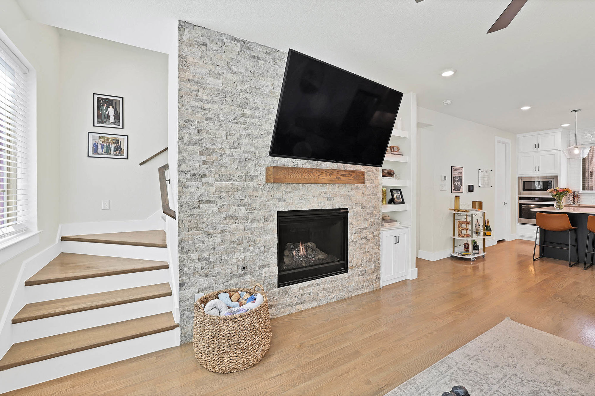 3920 Riesling Ridge Dallas, TX 75204 - Photo 9 of 26 a living room with furniture a flat screen tv and a fireplace