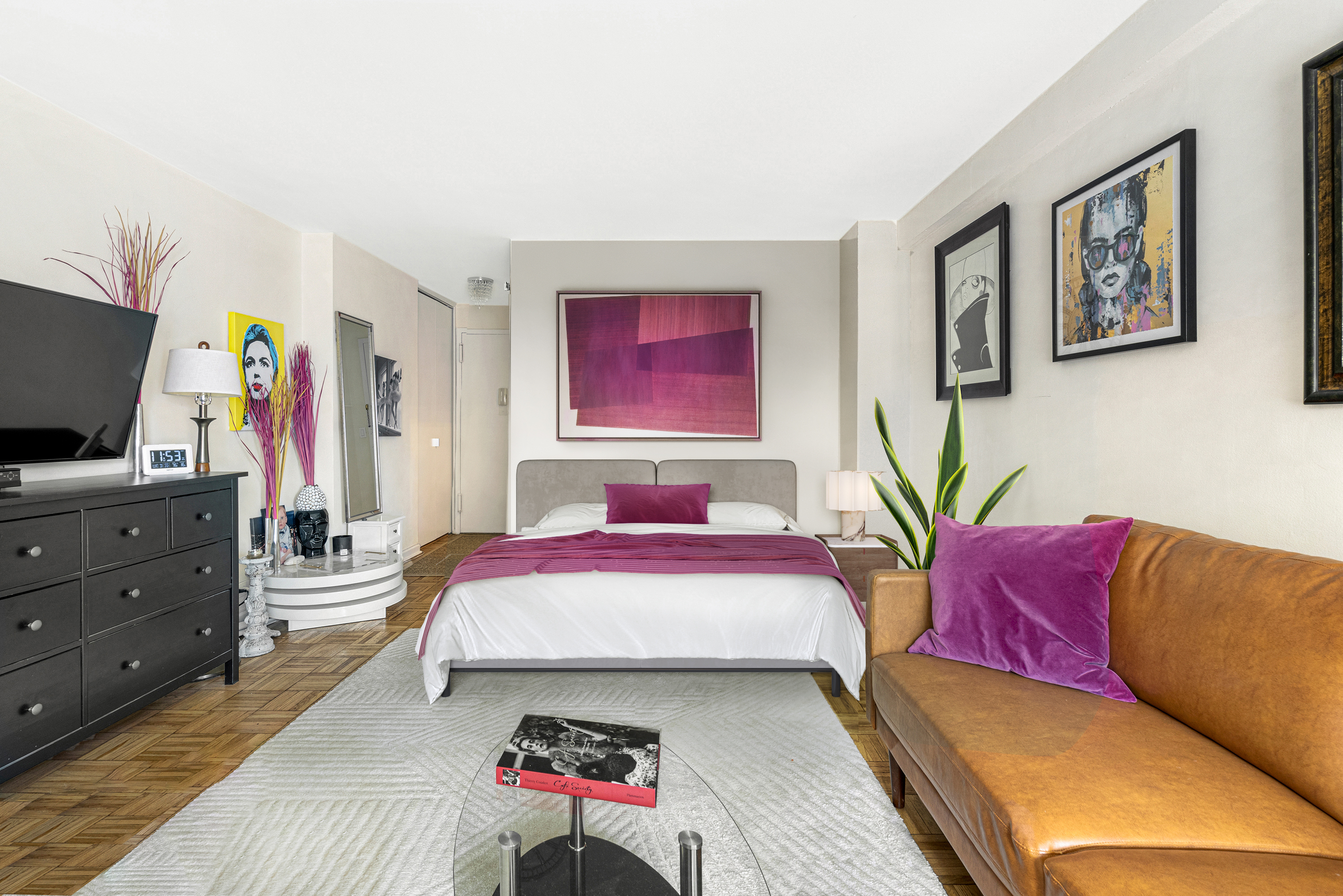 1160 3rd Avenue, Unit 15F Manhattan, NY 10065 - Photo 2 of 8 a living room with furniture and a flat screen tv