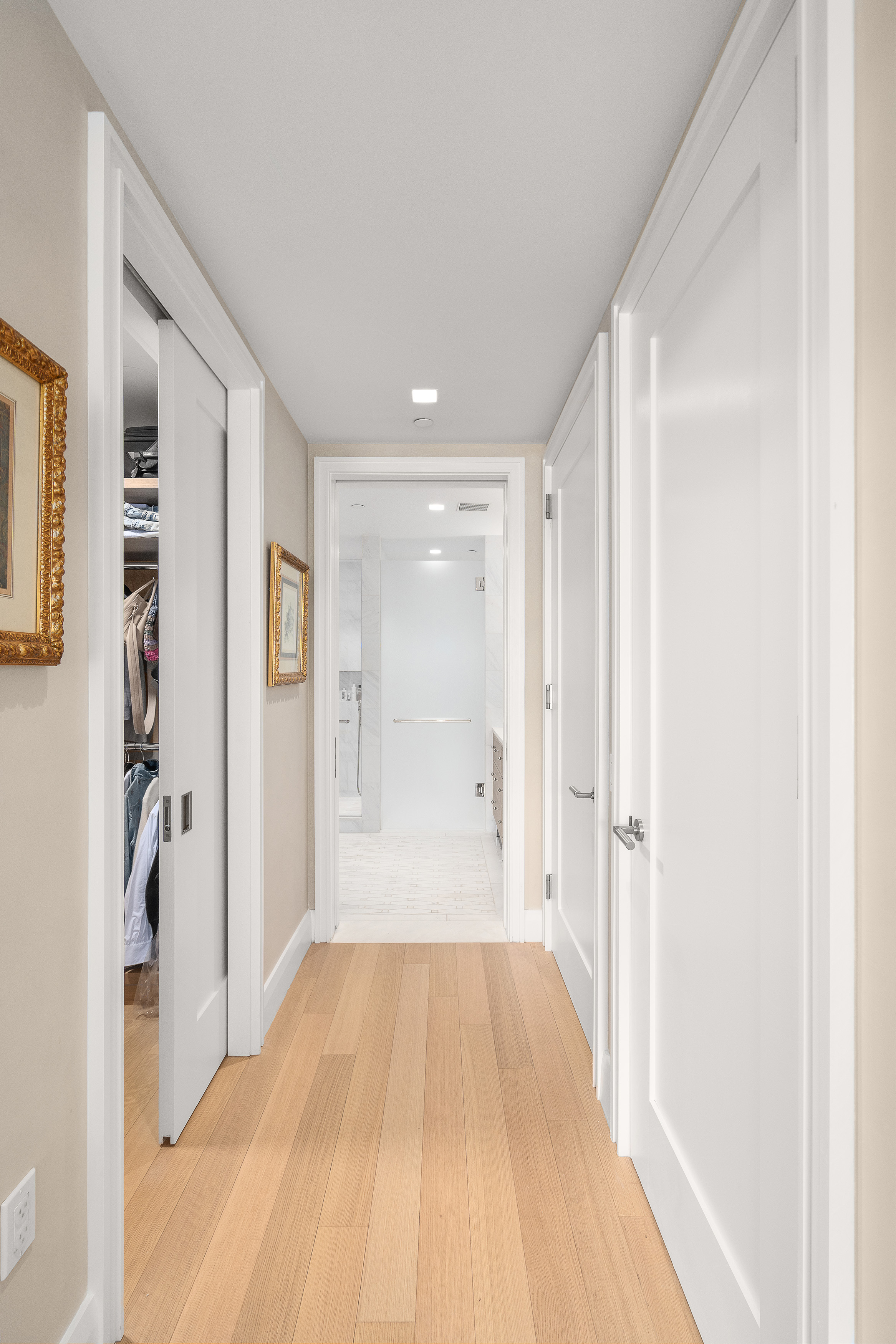 200 East 83rd Street, Unit 4E Manhattan, NY 10028 - Photo 9 of 29 a view of a room with wooden floor and a bathroom