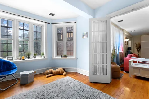 a bedroom with furniture and a window