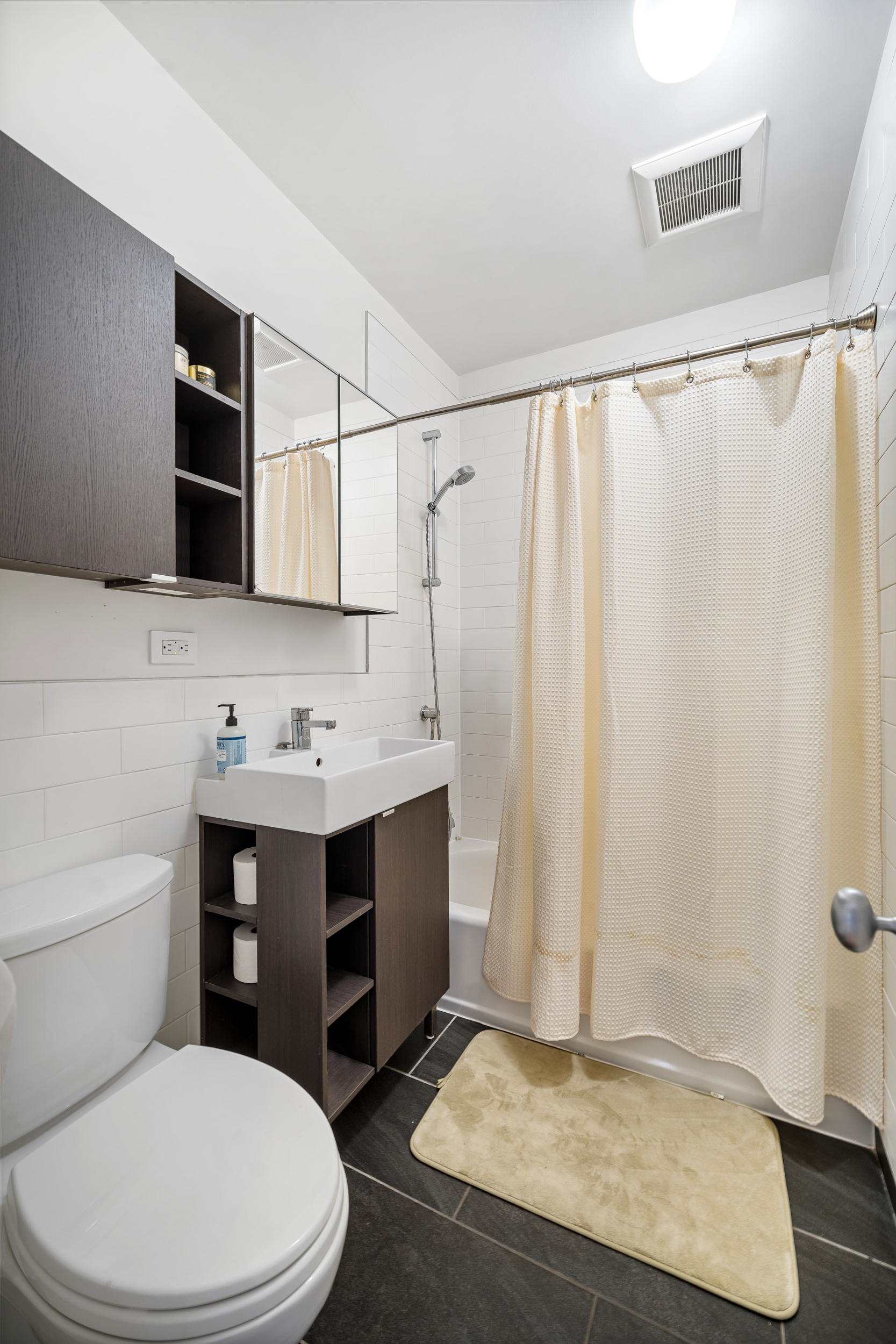 65 Jackson Street Brooklyn, NY 11211 - Photo 33 of 36 a bathroom with a sink a toilet and shower