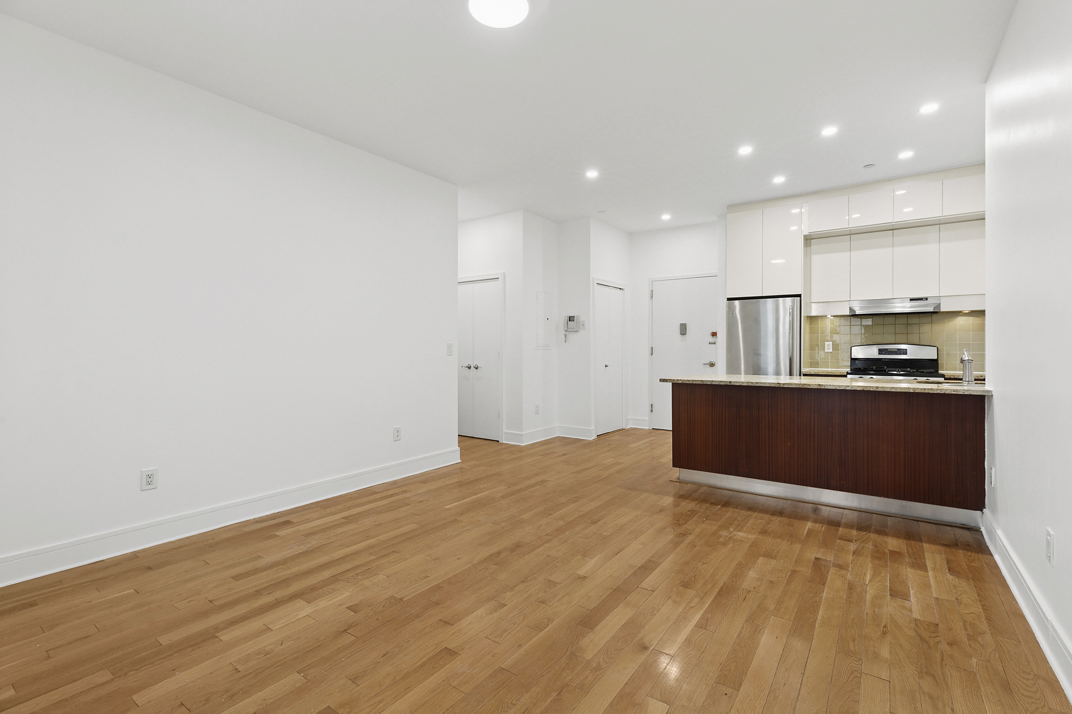 41-26 27th Street, Unit 4H Queens, NY 11101 - Photo 3 of 21 a view of kitchen with wooden floor
