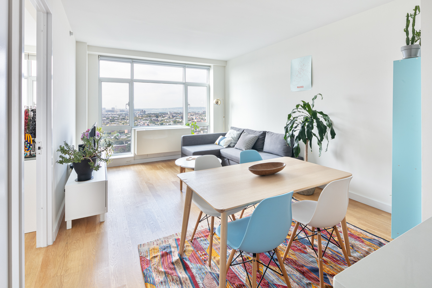 a view of a dining room with furniture and window
