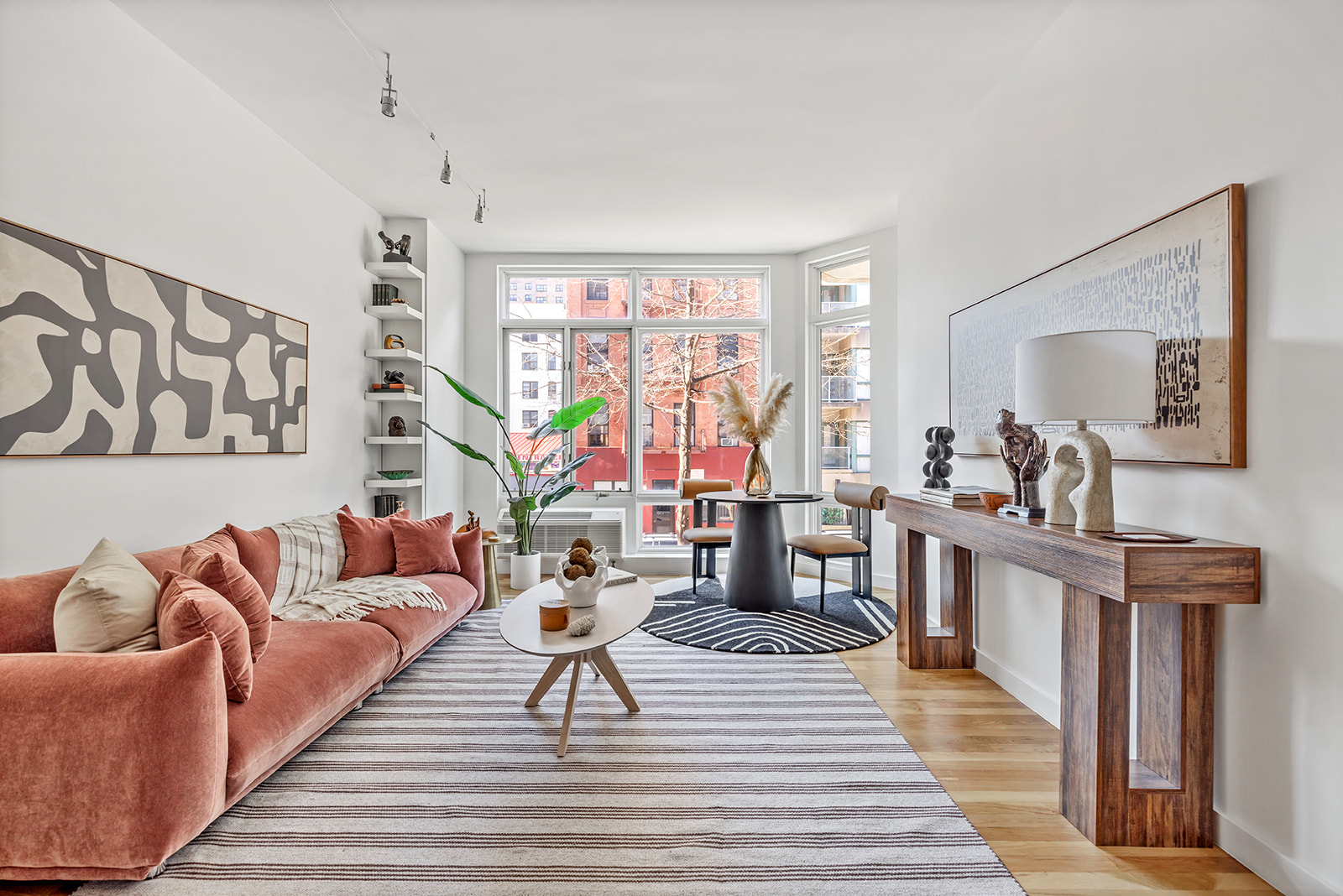 333 East 109th Street, Unit 2A Manhattan, NY 10029 - Photo 1 of 9 a living room with furniture or couch and a table