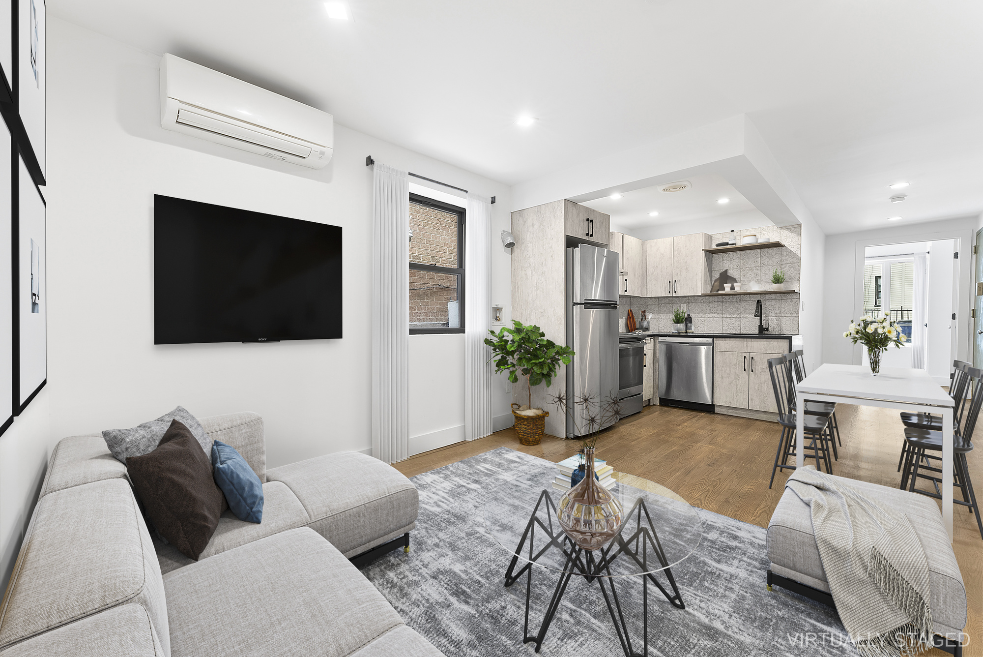 81 Eldert Street, Unit 1 Brooklyn, NY 11207 - Photo 3 of 9 a living room with furniture and a flat screen tv