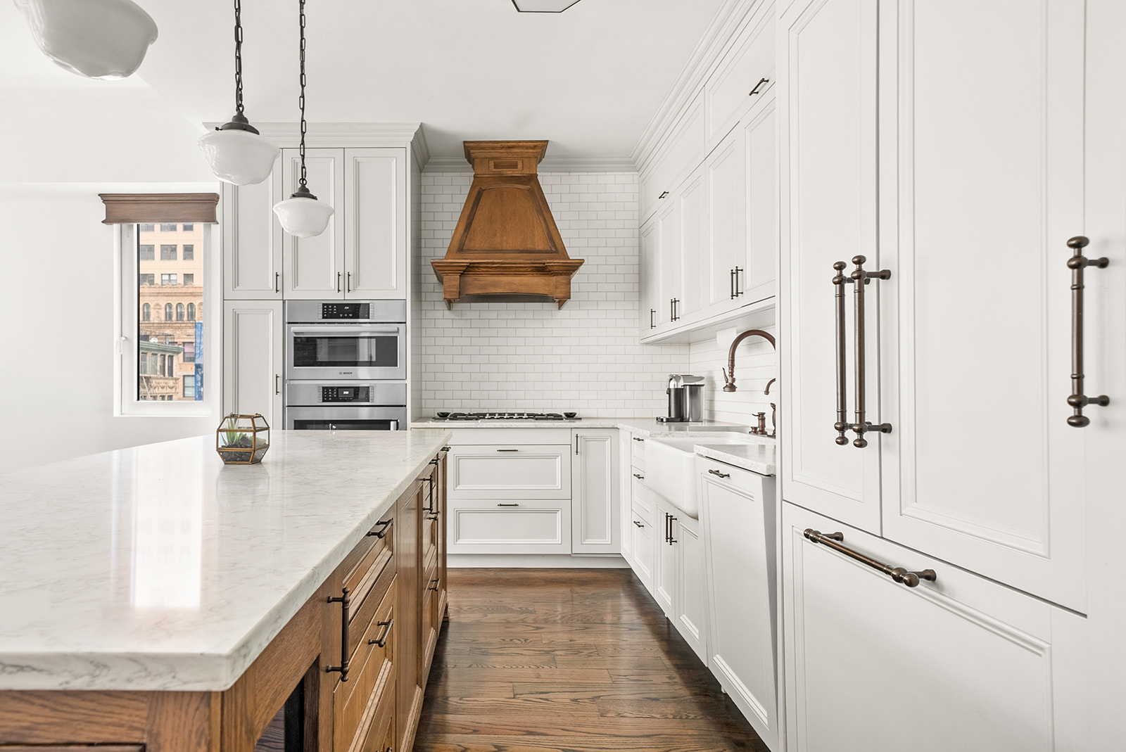 119 Fulton Street, Unit 8 Manhattan, NY 10038 - Photo 5 of 12 a kitchen with stainless steel appliances a sink stove and cabinets