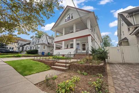 a front view of a house with garden